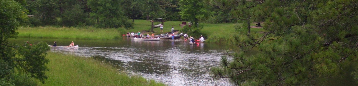 people canoeing on a river in Wadena County, MN